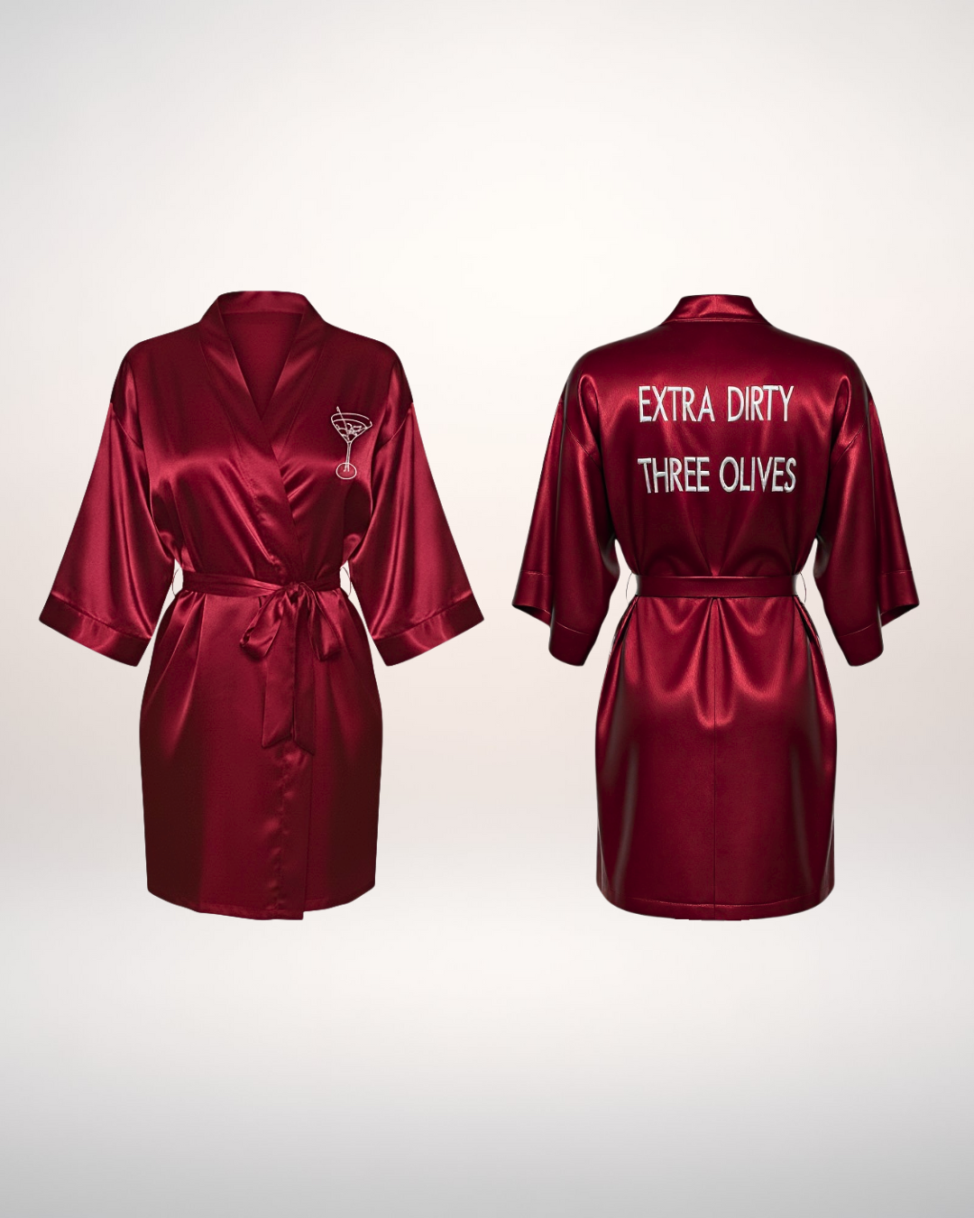 Two red satin robes on a white background, one with THE LA SAUM logo and the other with text that says extra dirty, three olives.